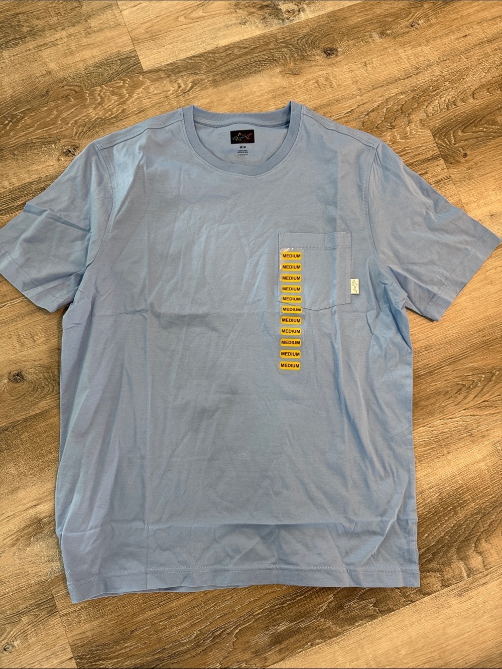 NWT Greg Norman Light Blue Pocket Tee with Vertical Patch Detail sz m
